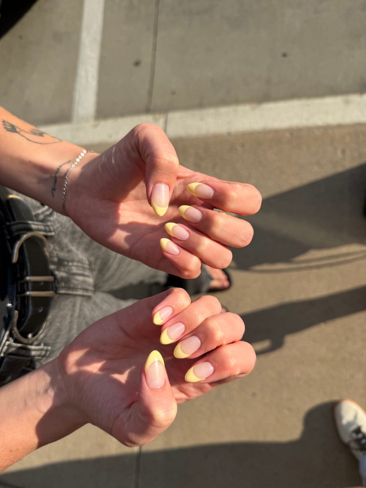 Pastel yellow French tip gel manicure on almond nails — Logan, UT