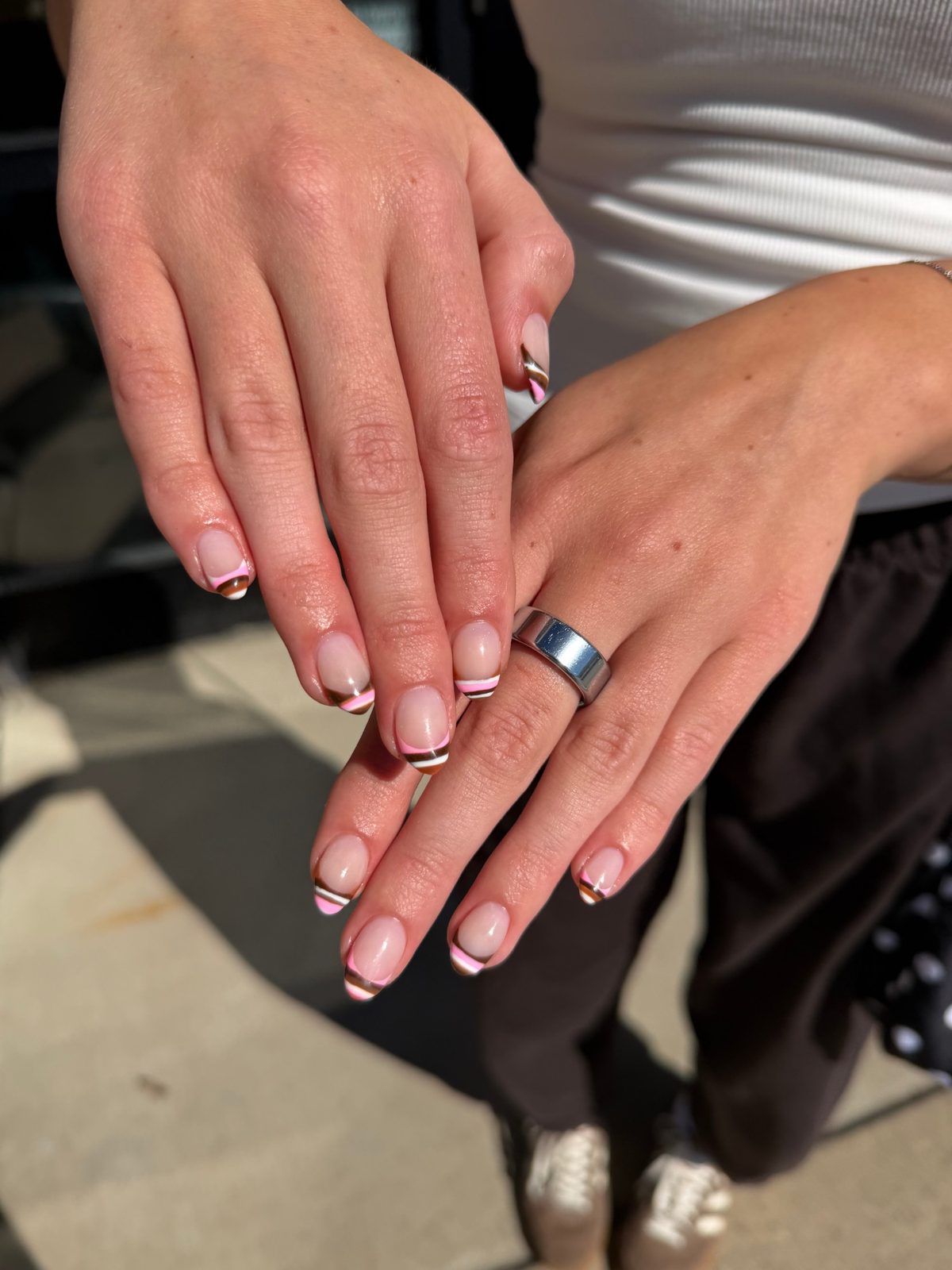 Retro pink, brown, and white striped French tips on short round nails