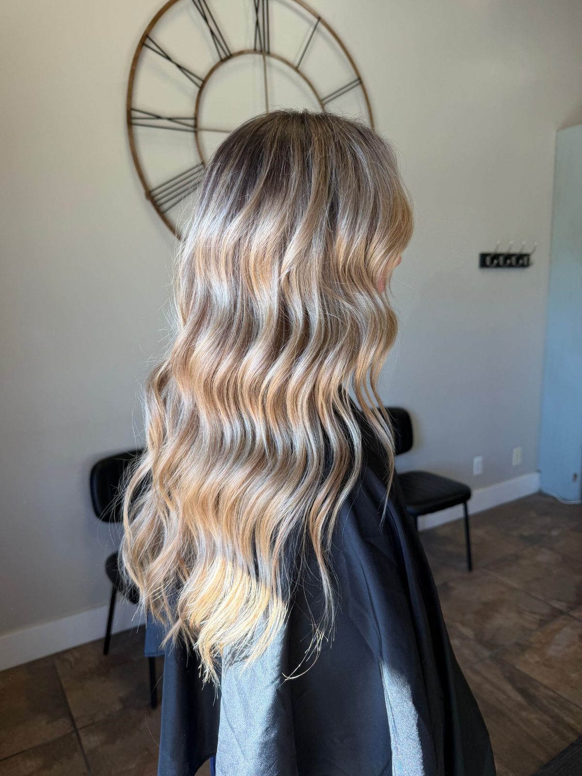 Rooted blonde balayage with long beachy waves
