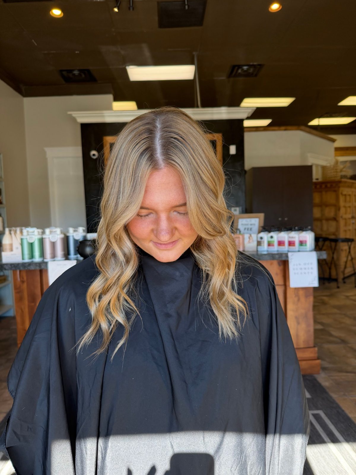 Honey blonde balayage with face-framing pieces and soft curls — Logan, Utah